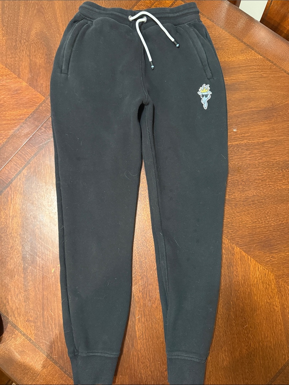 Kids Black Jogger Sweatpants with White Drawstring and Floral Patch